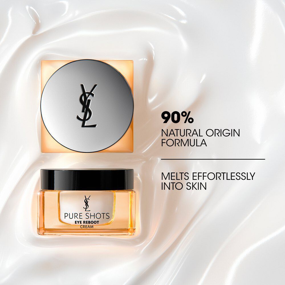 Tarro de YSL Pure Shots Eye Reboot Cream con tapa plateada, sobre una lujosa textura de crema blanca.