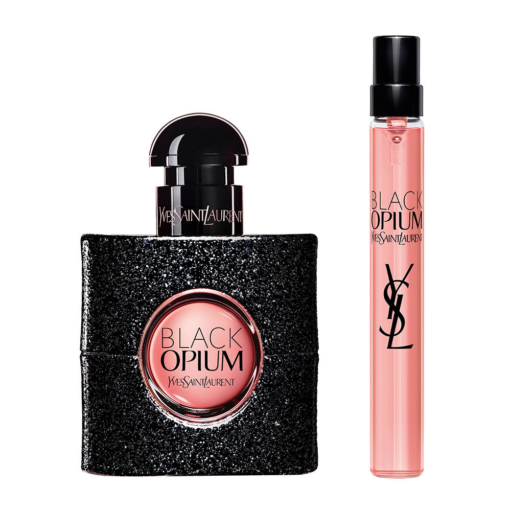Botella de Black Opium Eau de Parfum de 30 ml junto a un formato de viaje de 10 ml sobre fondo blanco.